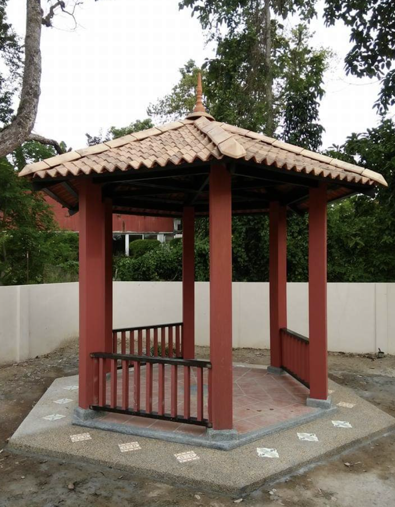 Before — freshly built red Chinese pagoda with clay-tile roof standing on a bare concrete pad, by GP FloraL in Penang