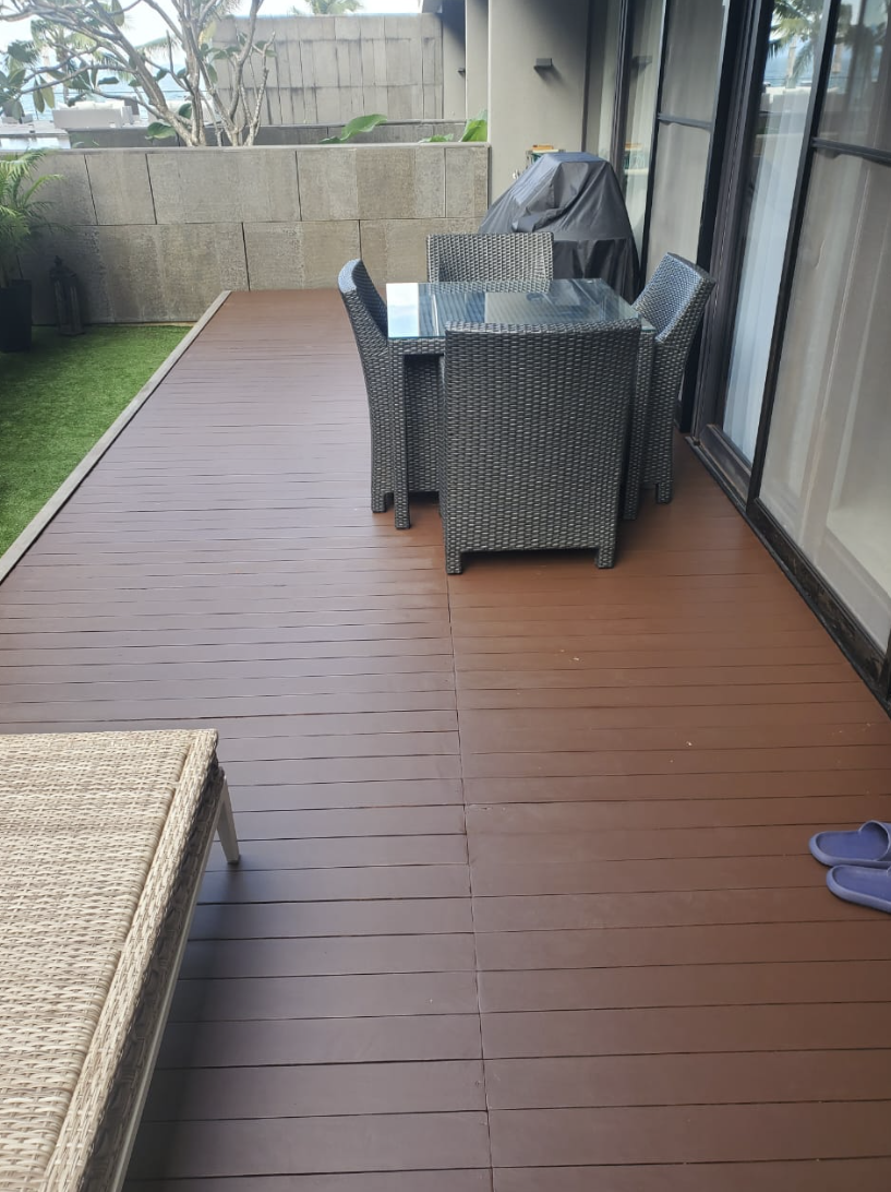 After — the same balcony deck rebuilt with new high-quality timber and a rich protective stain finish, by GP FloraL