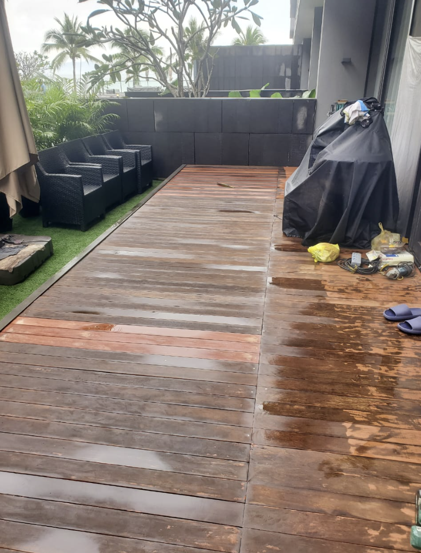 Before — old, worn and weathered timber deck panels faded grey before refurbishment by GP FloraL in Penang